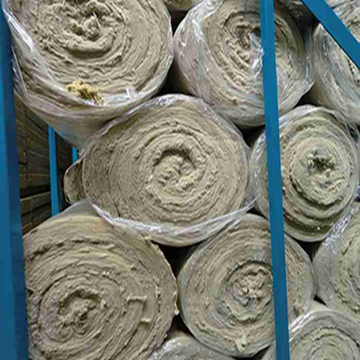 Shrink-wrapped insulation rolls stacked